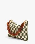The Clare Vivier Flat Clutch W/Tabs is a green and cream checkered knit crossbody bag with a chunky amber chain handle, shown against a plain white background.