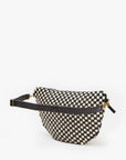 The Grande Fanny S25 by Clare Vivier is a black and white checkered crossbody bag with a black adjustable strap and gold hardware, shown on a plain white background.