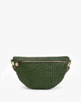 The Clare Vivier Grande Fanny S25, a dark green crossbody with a half-moon silhouette, showcases handwoven leather, a front zipper pocket, gold hardware, and a signature round gold charm against a white background.