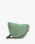 The Clare Vivier Grande Fanny S25 is a stylish crossbody bag with a green, black, and white checkerboard pattern, gold hardware, and a black adjustable strap, shown against a plain white background.