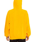 A person is seen from the back wearing Aviator Nation’s logo - pullover hoodie relaxed in bright yellow with the hood up and black jeans, against a plain white background.