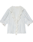 The Henri Top by DOEN is a white organic cotton voile blouse with light blue vertical stripes, a deep V-neckline with ruffled trim, and loose elbow-length sleeves finished with ruffled cuffs.