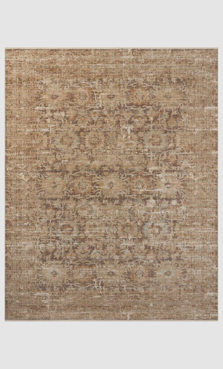 A Loloi Rugs Bark / Multi Rug featuring a weathered design in shades of brown and beige, with abstract, faded patterns throughout the surface, enhancing its Arizona-style appeal.