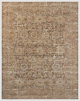 A Loloi Rugs Bark / Multi Rug featuring a weathered design in shades of brown and beige, with abstract, faded patterns throughout the surface, enhancing its Arizona-style appeal.