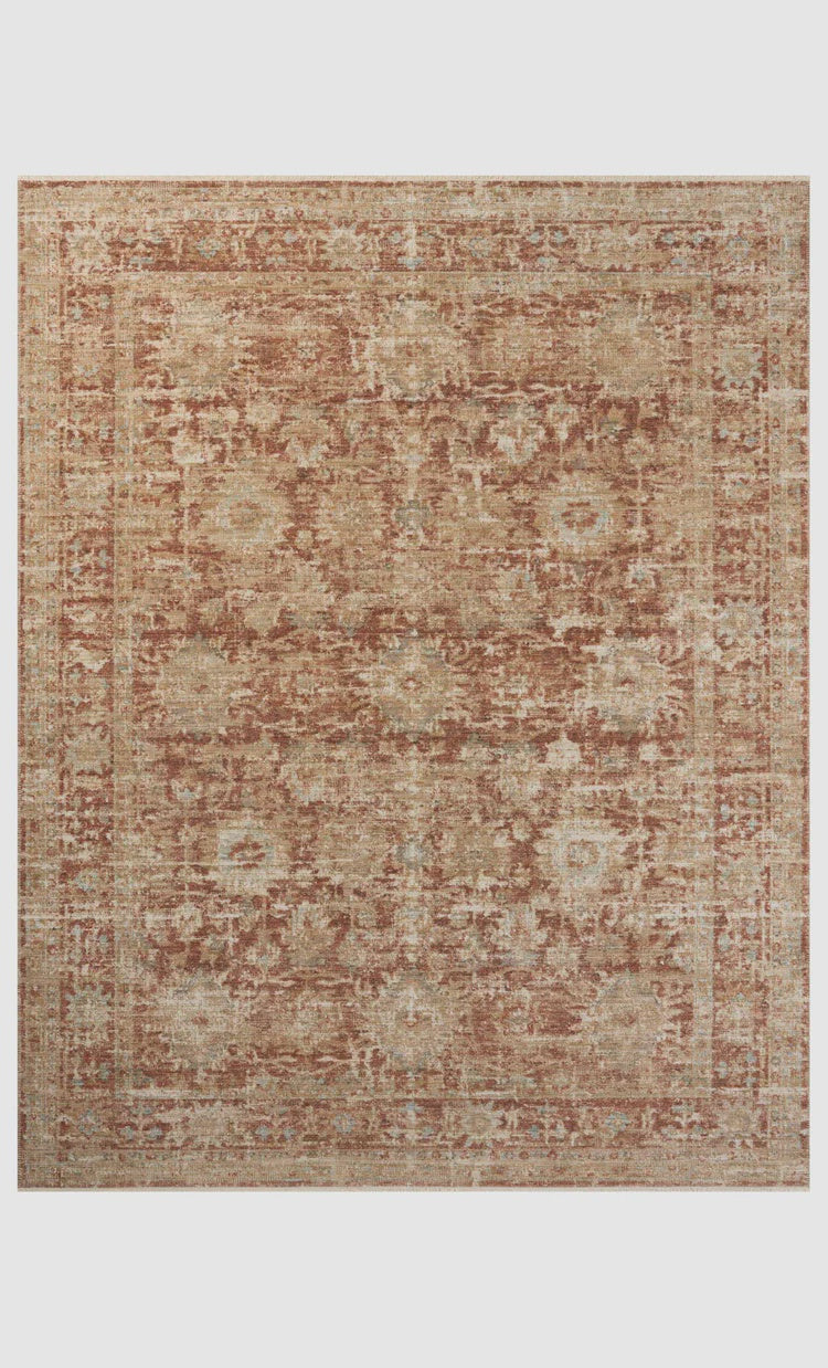 A Brick / Multi rug with an ornate traditional pattern in shades of beige and brown, inspired by the bungalow style of Scottsdale, Arizona, displaying symmetrical floral motifs and intricate border designs. Made by Loloi Rugs.