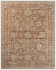 A Brick / Multi rug with an ornate traditional pattern in shades of beige and brown, inspired by the bungalow style of Scottsdale, Arizona, displaying symmetrical floral motifs and intricate border designs. Made by Loloi Rugs.