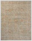 A textured Loloi Rugs Aqua/Terracotta Rug with a muted gray background and subtle accents of rust and beige in a distressed, Arizona style.