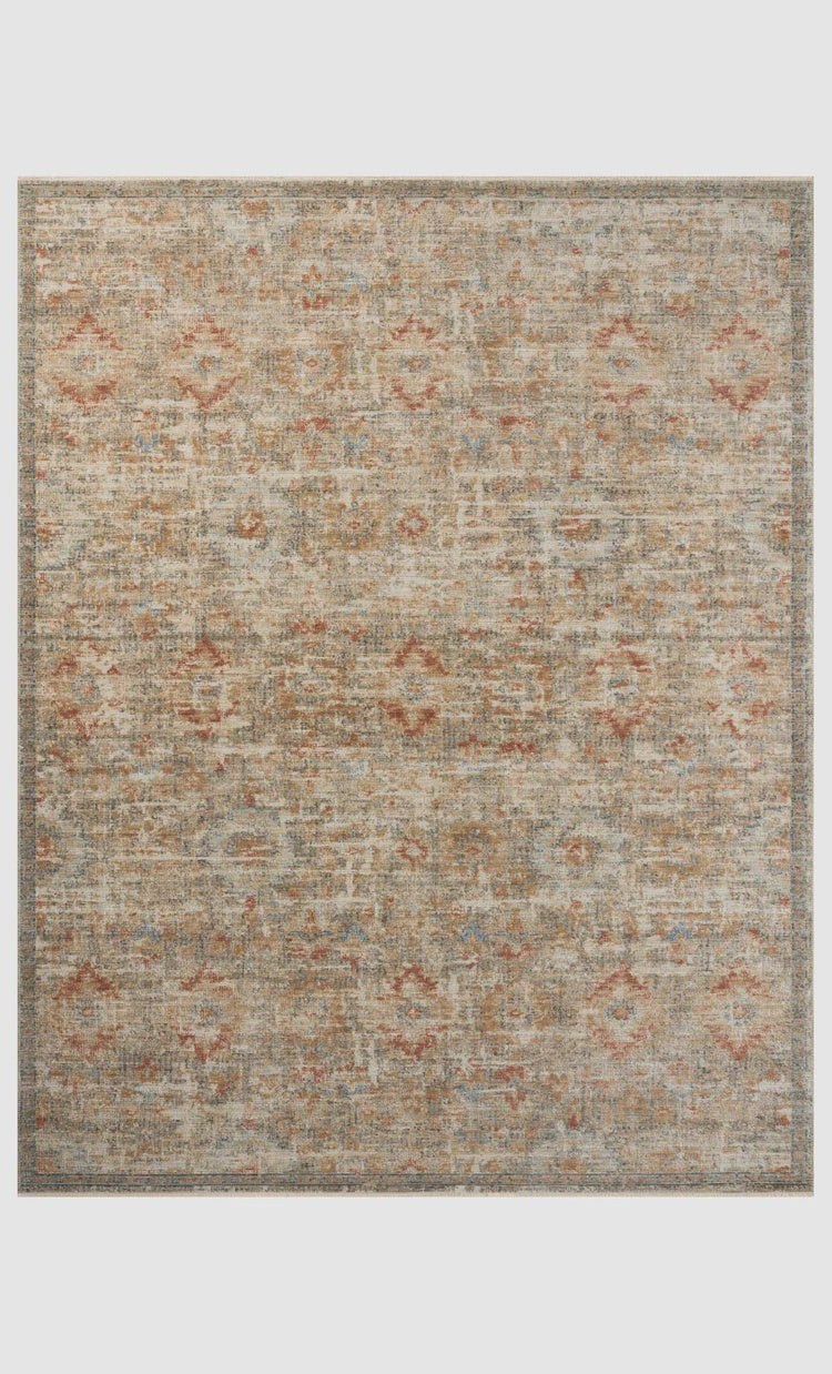A textured Loloi Rugs area rug featuring a faded pattern with hints of terracotta and beige on a grey background, bordered by a narrow dark edge, perfect for a Scottsdale, Arizona bungalow.
