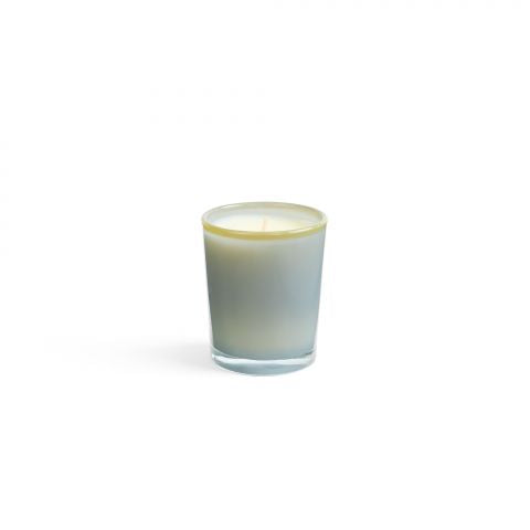 The Lafco NY Beach House Candle, made of soy wax, sits centered in a hand-blown frosted glass holder that contrasts elegantly with the plain white background.