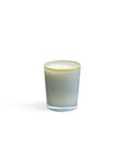 The Lafco NY Beach House Candle, made of soy wax, sits centered in a hand-blown frosted glass holder that contrasts elegantly with the plain white background.