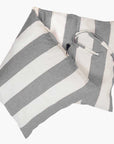 Two Hedgehouse Throwbed square pillows with wide horizontal gray and white stripes, featuring cotton removable, machine-washable covers, are stacked against a plain white background.