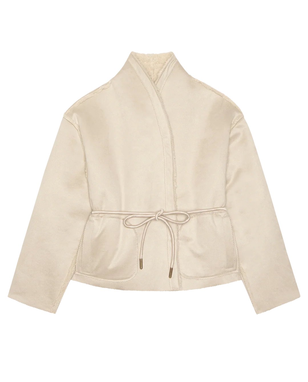 The Great Inc. Reversible Drover Coat features a beige, double-breasted wrap design with a shawl collar, long sleeves, front pockets, waist tie, and a soft suede-like texture for versatile style.