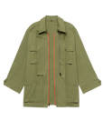 The Quilted Liner Parka by The Great Inc. is a green quilted coat featuring pockets and a removable faux fur collar.
