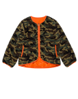 The Great Inc. Reversible Plush Bomber features a camo-patterned faux fur exterior, bright orange lining and trim, vintage military-inspired design, long sleeves, and two side pockets.