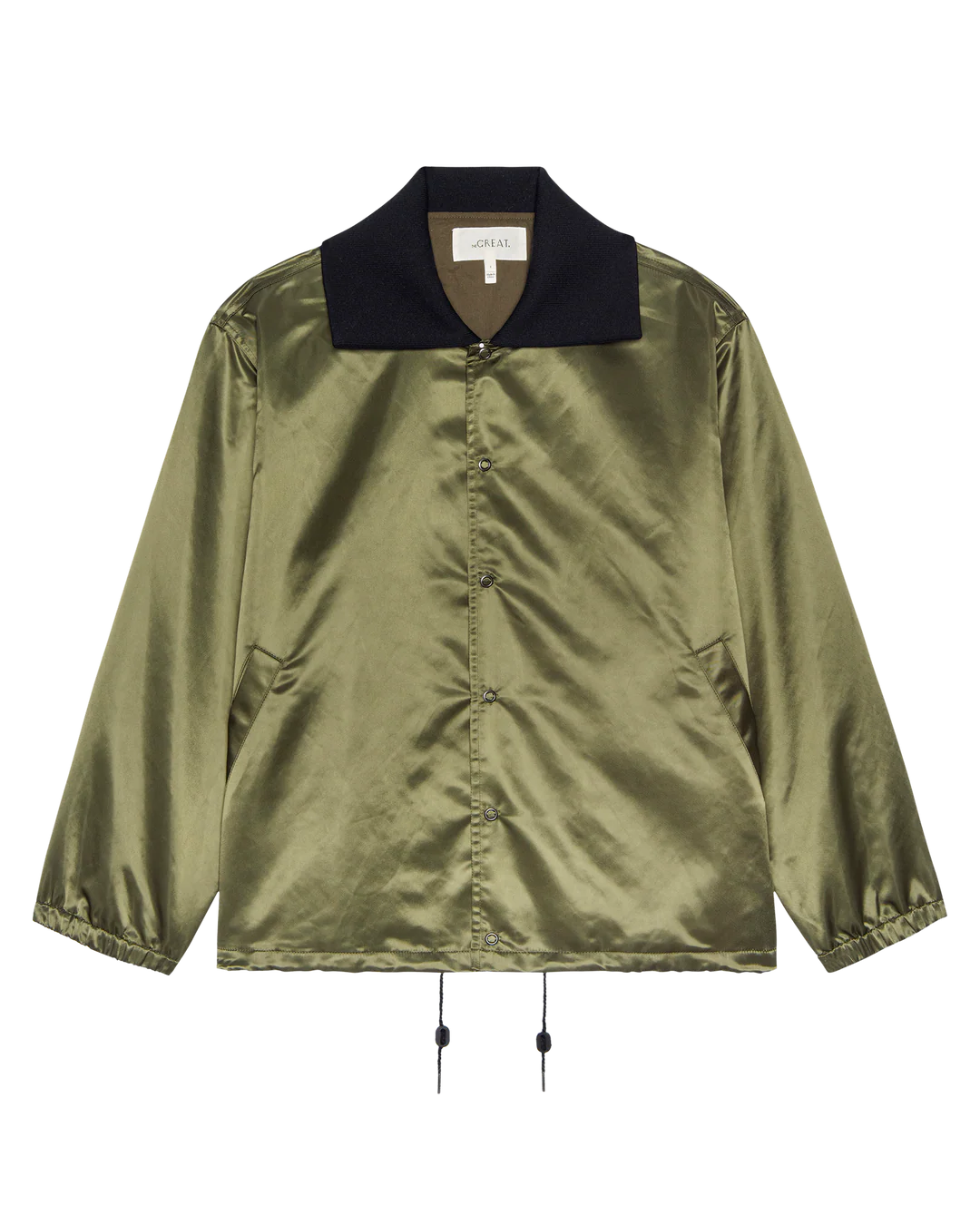 The Great Inc. Satin Coach's Jacket features shiny olive green satin, a black oversized rib collar, side pockets, elastic cuffs, and adjustable hem drawstrings for a classic vintage look, displayed on a white background.