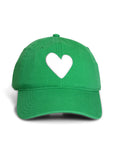 The Kerri Rosenthal KR Imperfect Heart Hat is a green baseball cap with a bold white heart emblem on the front, featuring a curved brim and visible stitching. This exclusive collector's item stands out as a distinctive color staple in the KR collection.