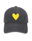 Dark gray hat with yellow heart patch by Kerri Rosenthal, KR Imperfect Heart Hat in Anthracite-Pear.