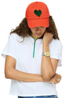 Red velvet KR Imperfect Heart Hat by Kerri Rosenthal, styled casually with a white tee and jeans.
