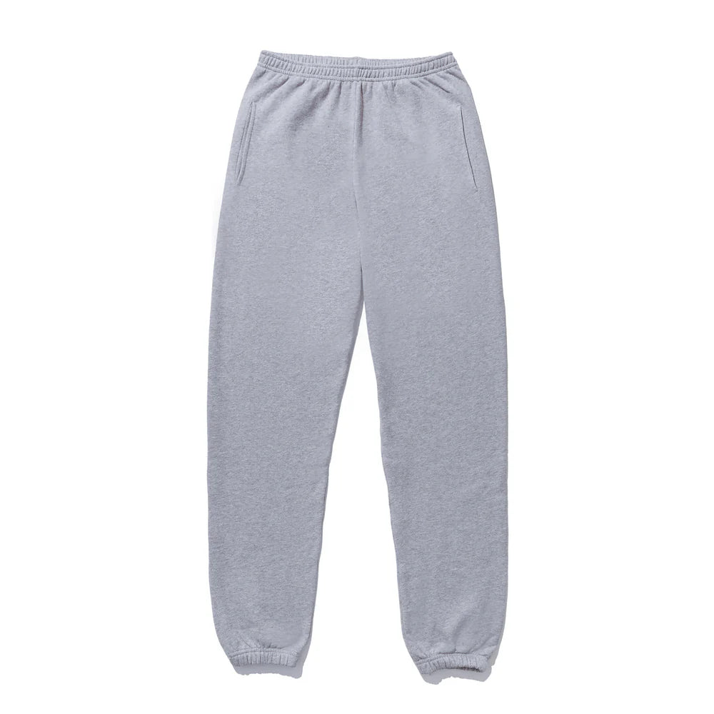 The Women's Organic Sweatpants by Kule are gray with an elastic waistband and cuffs, designed from cozy organic cotton for casual wear. They feature side pockets and are laid flat against a white background, embodying the essence of a leisure tuxedo.