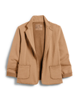 The Dublin Knit Blazer by Frank & Eileen is a light brown, 100% cotton everyday blazer featuring raw edges, two front pockets, rolled sleeves, and a relaxed fit.