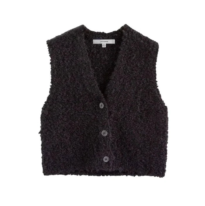 The LaTierra Aries Boucle Vest is a sleeveless black vest with a textured finish, a flattering v-neckline, and three cow horn buttons on the front, pictured against a plain white background.
