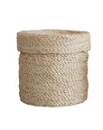 The Faire Round Lidded Jute Basket features a thick-rimmed, handwoven design from natural fibers and a slightly uneven texture, shown against a white background.