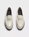 The Rag & Bone lexi loafer is a white slip-on with rounded toes and stitched details, featuring OrthoLite foam insoles for comfort, shown side by side on a light background.