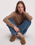 Rag & Bone Lexi loafers in a casual setting, styled with jeans and a brown sweater for a relaxed, modern look.