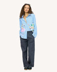 Mia Happimess Studio Shirt by Kerri Rosenthal styled with dark wide-leg pants and sneakers, casual chic look.