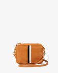The Clare Vivier Midi Sac S25 is a small, rectangular tan leather crossbody bag with a long strap, front pocket, vertical black and white center stripe, chambray-lined interior, and gold-tone hardware.