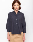Monday12 Zoe Shirt in Slate and beige skirt modeled against a white background, modern casual style.
