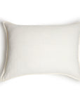 The Montauk Big Pillow 28x36 by POM POM is a rectangular, white pillow made from hand-loomed linen with flanged edges and a simple design, shown on a white background.