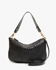 The Clare Vivier Moyen Messenger S25 is a black handwoven leather bag with gold hardware, a short shoulder strap, zippered top, and a detachable crossbody strap for versatile styling.