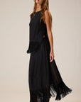 Sleeveless silk Jessie Top with fringe hem by Natalie Martin, styled sideways against a plain background.