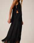 Jessie Top by Natalie Martin with fringe hem shown on model against a plain backdrop.