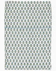 The Cala Fitted Sheet by John Robshaw is crafted from organic cotton percale and features a repeating pattern of small green and blue abstract shapes on a white background.