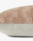 A close-up of the PAL0023 Dolly Clay Pillow by Loloi Rugs, featuring a rectangular shape, textured beige and tan checkered pattern on top, solid light fabric underneath, and the Loloi logo subtly displayed against a plain background.