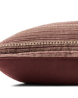 A side view of the Loloi Rugs PCJ0023 Howie Wine Pillow 13x21 shows its rectangular cotton build, textured striped brown and beige top, and solid brown bottom, set against a white background.