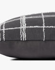 The Loloi Rugs PJS0012 Graphite/Ivory Pillow (13x35) features a dark gray base with a white grid pattern, fuzzy textured lines, and a knife edge design, displayed against a plain white background.