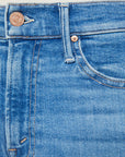 Close-up of the waistband and upper pocket of Mother’s Lil Insider Crop Step Fray jeans, featuring a metal button, belt loop, and copper rivet near the pocket corner.