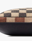The PLL0180 Muliti Pillow 20x20 by Loloi Rugs features a checkered beige, brown, and black design on top with solid dark polyester sides, shown side view on a white background. Includes a hidden flap zipper for easy care.
