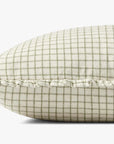 A close-up side view of the Loloi Rugs PCJ0012 Ivory Moss pillow, showing its green and white checkered pattern, hidden zipper, and ruffled fringe edge, set against a plain white background.
