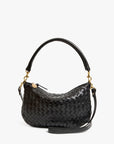 The Clare Vivier Petit Moyen Messenger S25 is a black handwoven leather mini messenger bag with a curved top handle, detachable gold hardware, and adjustable crossbody straps, shown against a plain white background.