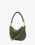 The Petit Moyen Messenger S25 by Clare Vivier is a green handwoven leather mini bag with a short handle, long crossbody straps, gold hardware, and a basket-like texture, displayed against a plain white background.