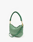 The Clare Vivier Petit Moyen Messenger S25, with its green and white checkerboard design, curved handle, and detachable crossbody straps, is elegantly displayed on a simple light background.