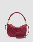 Red handwoven leather messenger with rounded handle and gold hardware by Clare Vivier, Petit Moyen style.