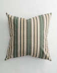 The Pindler CARPENTER 26x26 Pillow features vertical green, beige, and white stripes on a light background. This custom-made throw pillow has slightly pointed edges for a plump, elegant look and firm support. Photographed from above.