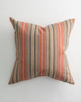 The Pindler CARPENTER 26x26 Pillow features vertical red, beige, and blue stripes and a plush down insert for comfort. This luxurious square pillow is shown on a white background.