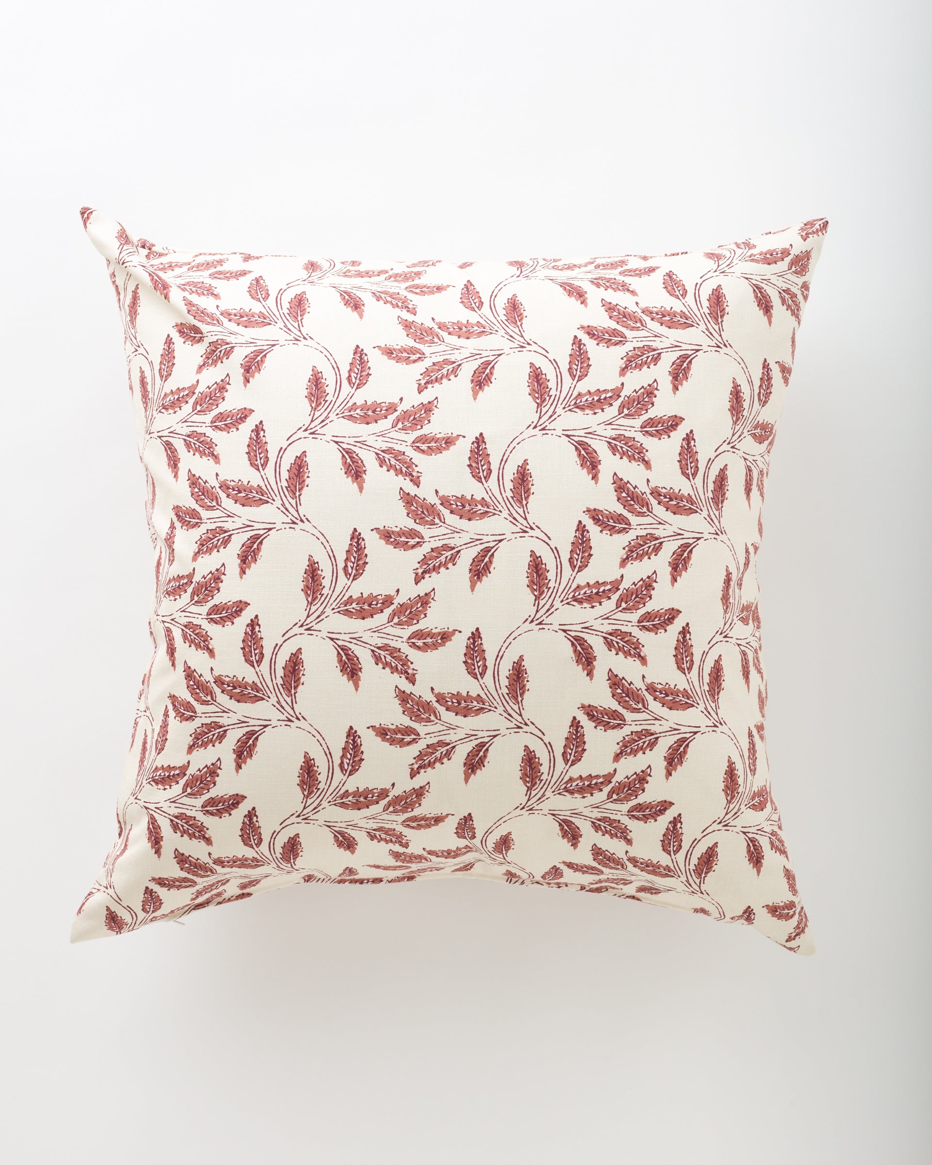 The Ajanta 26x26 euro pillow by Pindler features a cream background with a delicate, symmetrical red leafy branch pattern, creating an elegant and decorative look.