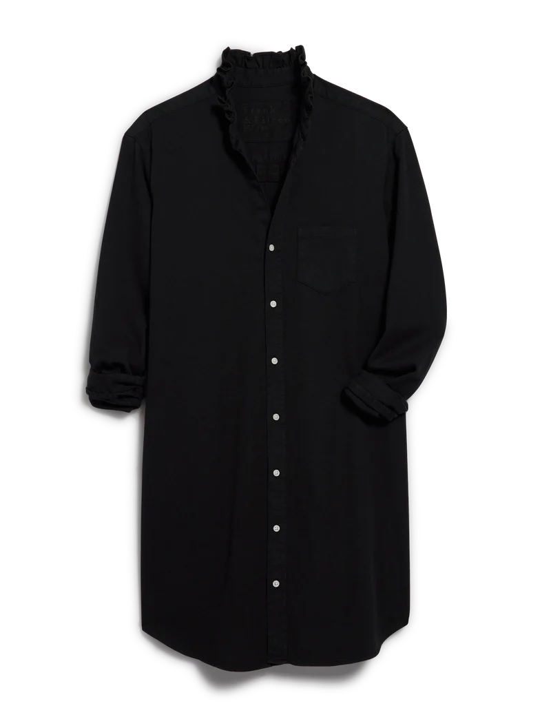 The Mary Classic Shirtdress-Ruffle by Frank & Eileen features a black ruffle collar, white buttons, chest pocket, and rolled-up long sleeves for effortless style.